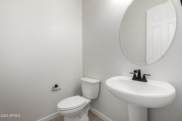 bathroom with toilet and sink