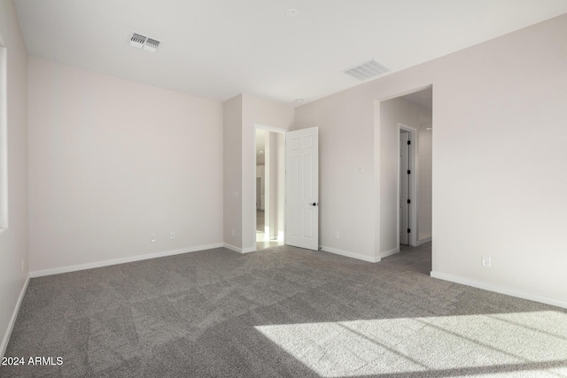 empty room featuring carpet floors