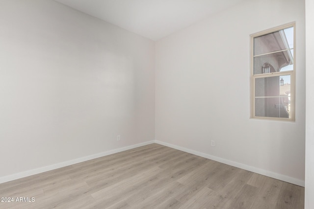 empty room with light wood-type flooring