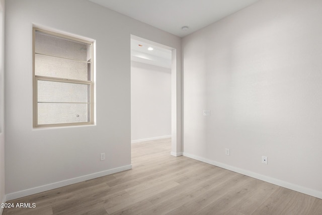 spare room featuring light hardwood / wood-style flooring