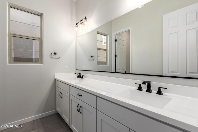 bathroom with tile patterned flooring and vanity