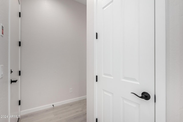 corridor featuring light hardwood / wood-style flooring