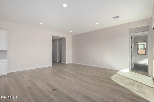 unfurnished living room featuring light wood-type flooring