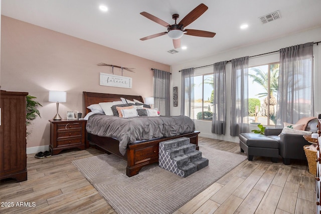 bedroom with ceiling fan and light wood-type flooring