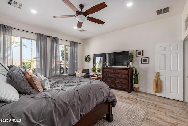 bedroom featuring access to outside, light hardwood / wood-style floors, and ceiling fan