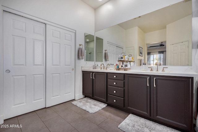 bathroom featuring vanity, tile patterned floors, and ceiling fan