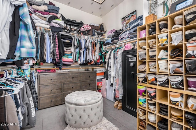 spacious closet with light tile patterned flooring