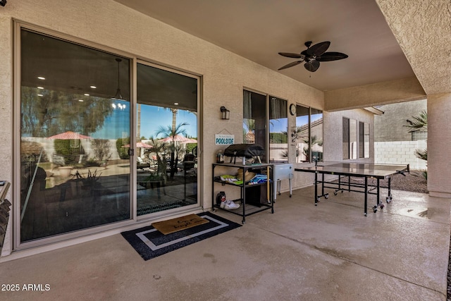 patio terrace at dusk with ceiling fan