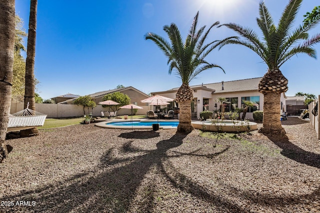 view of yard featuring a fenced in pool and a patio