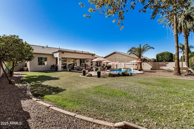 view of yard featuring a fenced in pool and a patio area