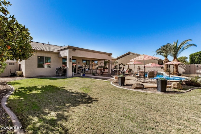 view of yard featuring a patio and a storage unit