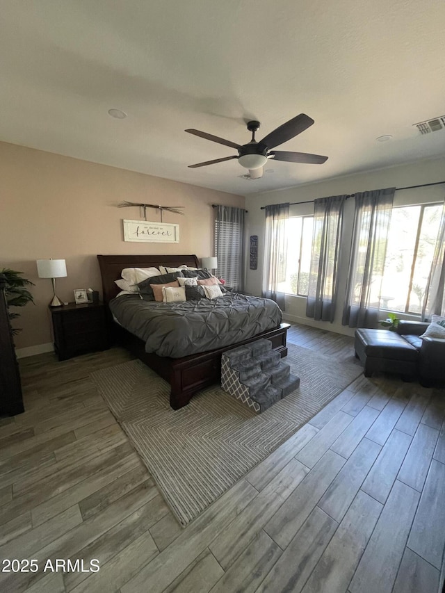 bedroom with ceiling fan and light wood-type flooring