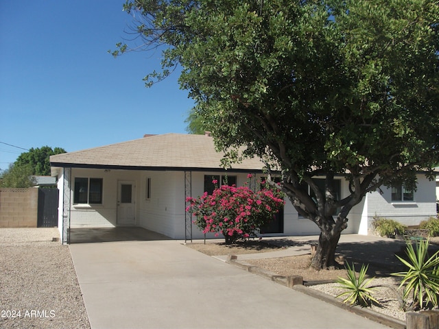 ranch-style home with a carport