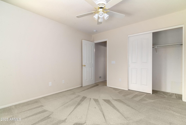 unfurnished bedroom with ceiling fan, carpet flooring, and a closet