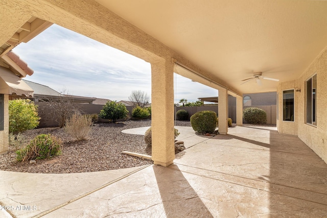 view of patio featuring ceiling fan