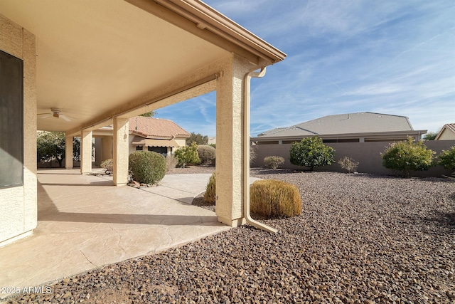 view of patio featuring ceiling fan