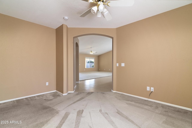 empty room featuring carpet floors and ceiling fan