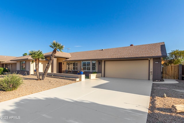 single story home with a garage