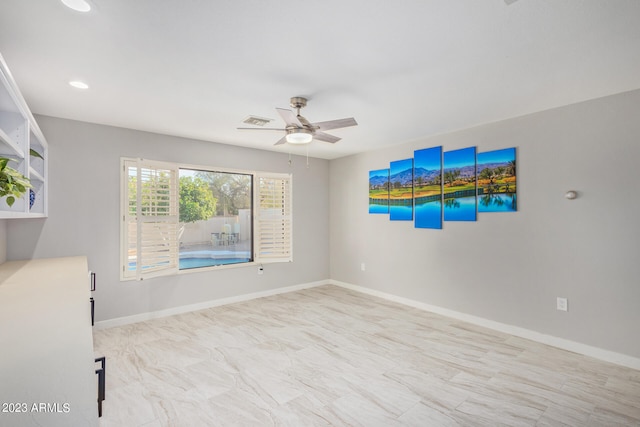 unfurnished room with ceiling fan