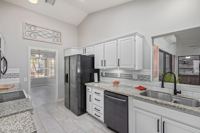 kitchen with appliances with stainless steel finishes, backsplash, sink, and white cabinets