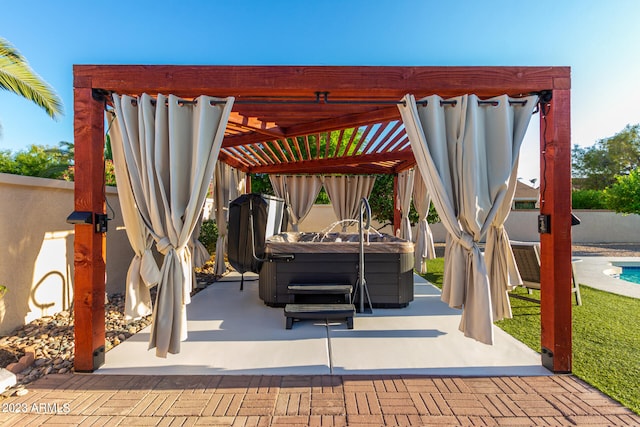 view of patio featuring a hot tub and a pergola