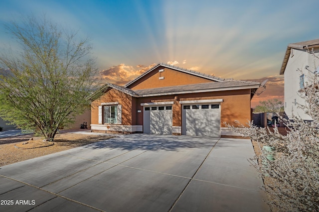 view of front of property with a garage