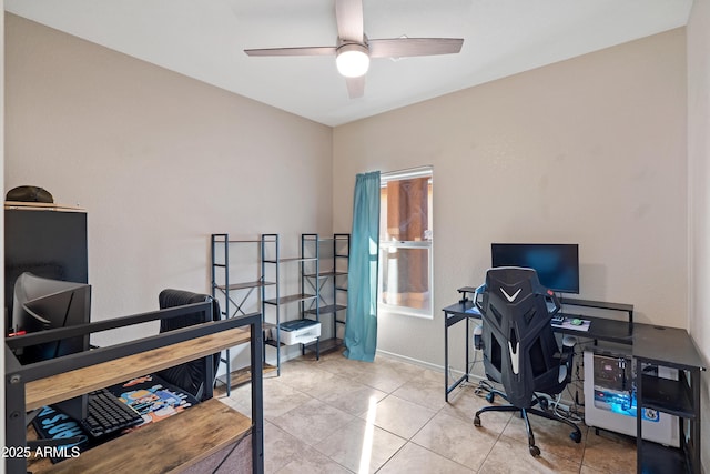 office area with light tile patterned floors and ceiling fan