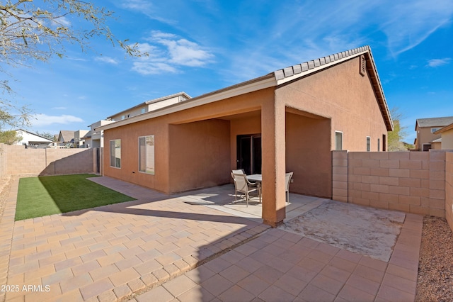 rear view of house with a patio area