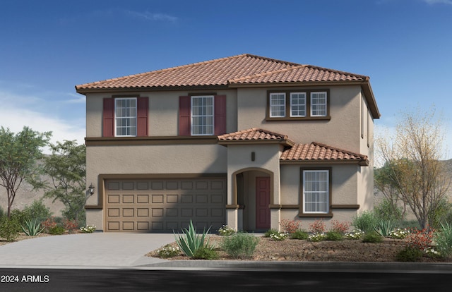 mediterranean / spanish-style house featuring a garage