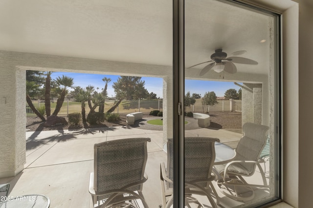 exterior space featuring ceiling fan