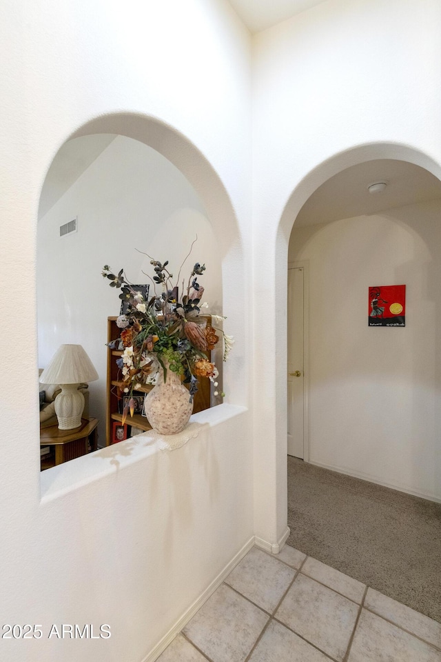 hall featuring tile patterned floors