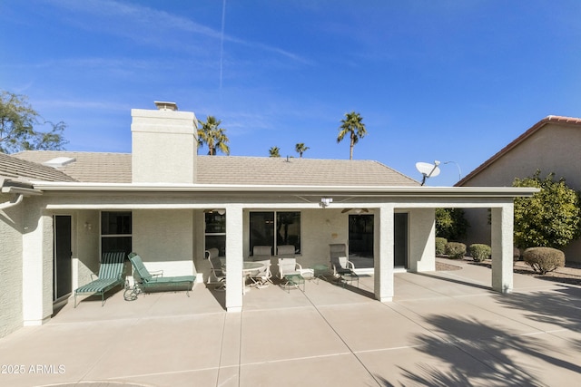 rear view of property with a patio area