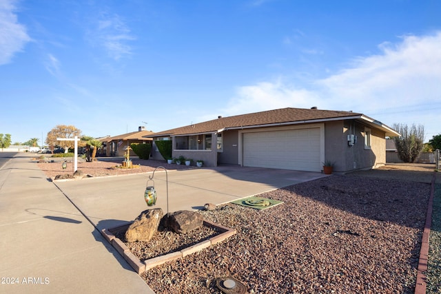 ranch-style house featuring a garage