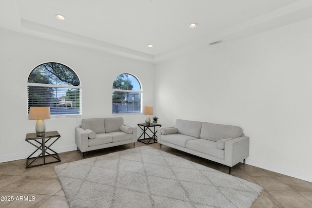 7917 S 32nd Ter, Phoenix, AZ 85042 - living room featuring tile patterned floors and a raised ceiling