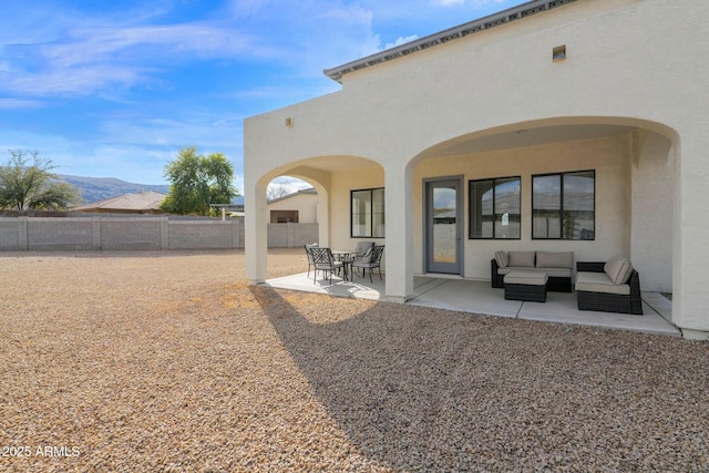 7917 S 32nd Ter, Phoenix, AZ 85042 - rear view of property featuring an outdoor living space, a mountain view, and a patio area