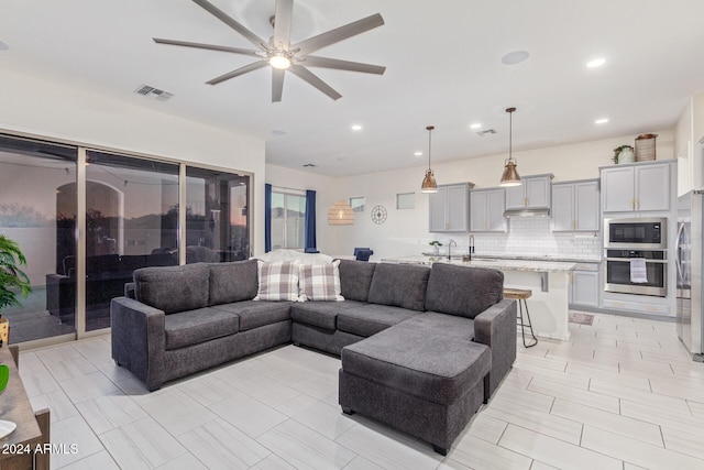 living room featuring ceiling fan