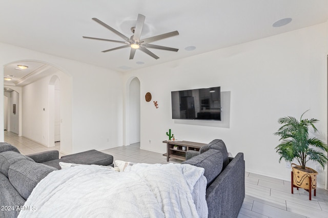 living room featuring ceiling fan and light wood-type flooring