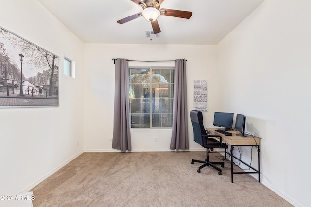 office area with ceiling fan and light colored carpet