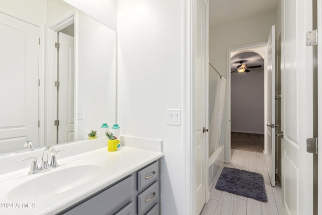 bathroom featuring shower / bath combo, vanity, and hardwood / wood-style flooring