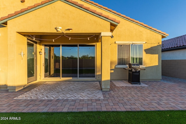 rear view of property with a patio area