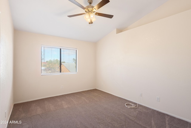 empty room featuring carpet flooring, lofted ceiling, and ceiling fan