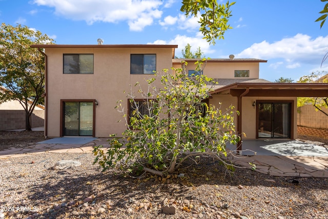 rear view of property featuring a patio