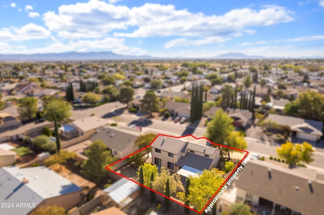 birds eye view of property with a mountain view