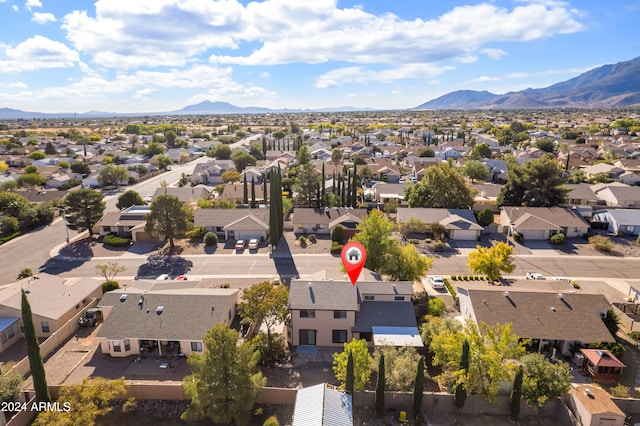 birds eye view of property with a mountain view