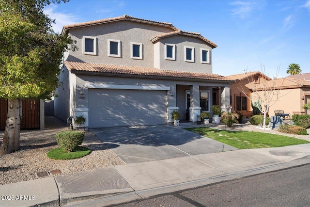 mediterranean / spanish home featuring concrete driveway, fence, a tile roof, and stucco siding