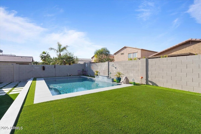 view of swimming pool featuring a fenced in pool, a lawn, and a fenced backyard