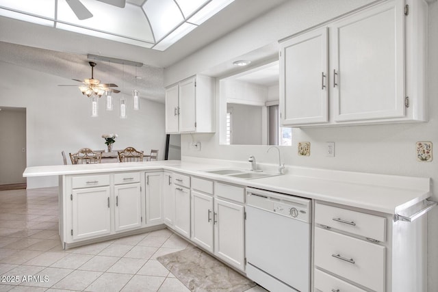 kitchen with white dishwasher, sink, white cabinetry, and kitchen peninsula