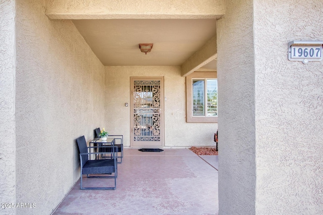 property entrance with a patio area