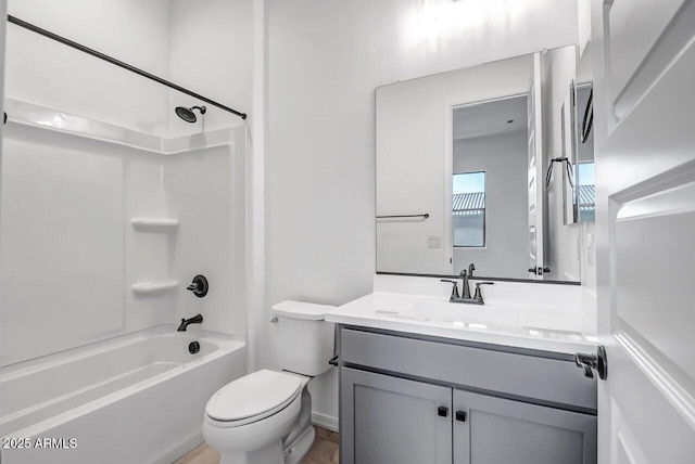 full bathroom featuring shower / tub combination, vanity, and toilet