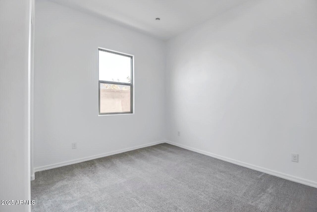 unfurnished room with carpet flooring